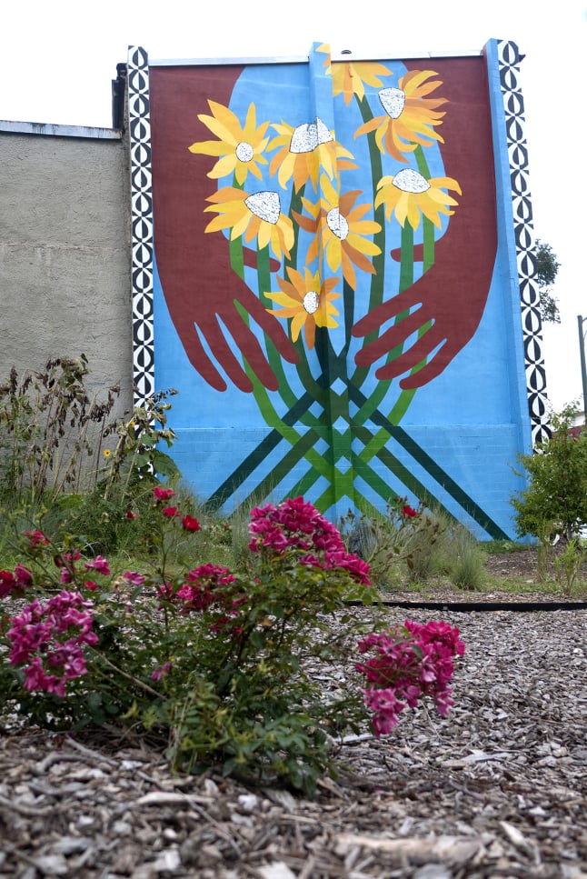 Sunflower Village garden mural diptych in Baltimore, MD by Emily C-D with Jessie and Katey (artist trio Can Collective), 2012.
